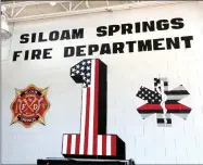  ?? Photo submitted ?? Siloam Springs High School Art Honor Society students painted on the south-facing truck bay wall inside Siloam Springs Fire Department Station No. 1.