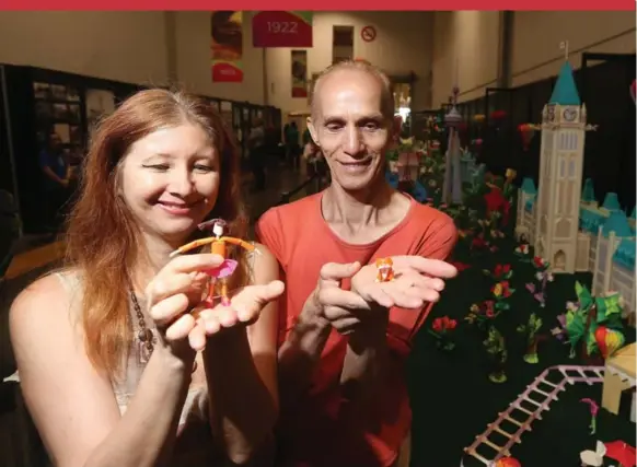  ??  ?? Katrin and Yuri Shumakov designed the exhibit and folded paper for nine months to create the Massive Canada 150-themed origami diorama at the CNE. It’s more than 30 metres long.