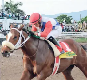  ??  ?? PATRIARCH (Dick Cardenas) scoring an easy six-lengths win in yesterday’s PICK3 ‘Super Challenge’ Trophy race for two-year-olds at Caymanas Park last month.