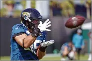  ?? JOHN RAOUX — THE ASSOCIATED PRESS ?? Then-Jaguars tight end Tim Tebow makes a reception during a drill July 31 in Jacksonvil­le, Fla.