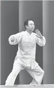  ??  ?? A Yu Tian teacher gives a Wushu demonstrat­ion.