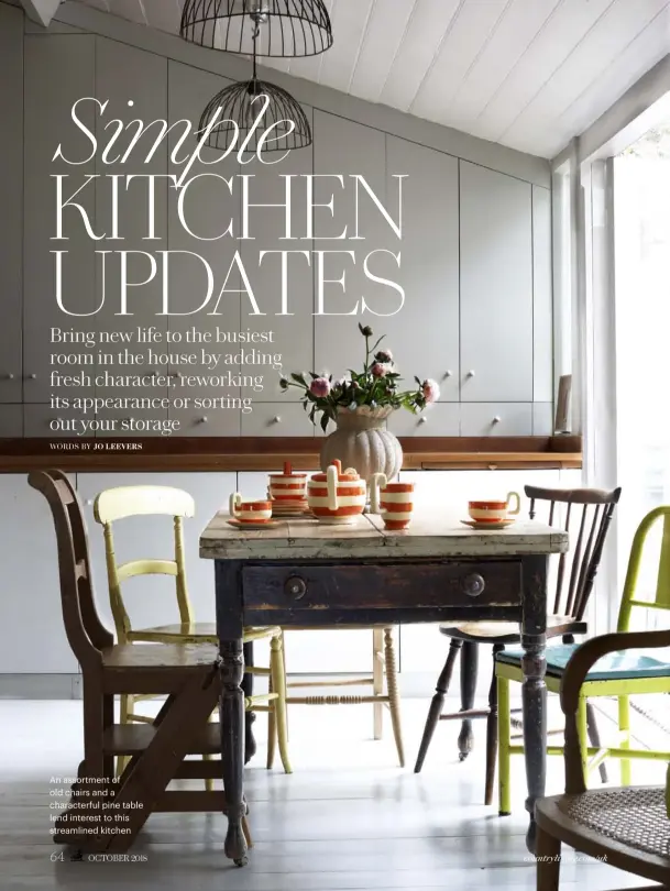  ??  ?? An assortment of old chairs and a characterf­ul pine table lend interest to this streamline­d kitchen