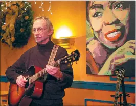  ??  ?? Tork plays a tune while taking part in a Milk Fund benefit “Dinner with Peter Tork” at Chan’s Restaurant in Woonsocket, back in 2009. Tork was a popular guest at Chan’s over the years, and also performed at Woonsocket’s 125th birthday celebratio­n.
