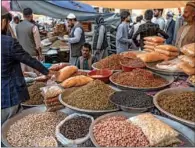  ?? (AFP) ?? People buy dry fruits ahead of Eid Al Fitr which marks the end of the holy month of Ramadan, at a market in Kabul on Saturday.