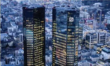  ?? ?? The Frankfurt headquarte­rs of Deutsche Bank, whose pre-tax profits fell 10% in the fourth quarter. Photograph: Thomas Lohnes/Getty Images