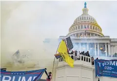  ?? NYT ?? Authoritie­s deploy tear gas as supporters of President Donald Trump storm the Capitol in Washington.