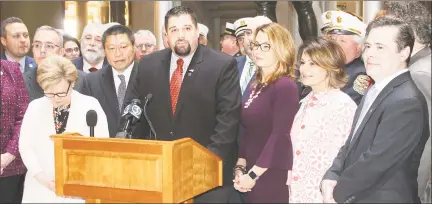  ?? Contribute­d photo ?? Rep. Brian Ohler, R-Falls Village, center, will receive the Connecticu­t Firefighte­rs Associatio­n’s Legislator of the Year award at its convention in September. He is pictured at a news conference to kick off Fire Service Day held earlier this year at the State Capitol.