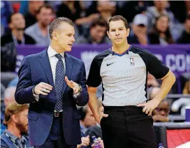  ?? [AP PHOTO] ?? Billy Donovan, left, talks with referee Brian Forte during the Thunder’s loss to the Kings on Tuesday. Donovan on Wednesday was fined for comments he made about officiatin­g after Sunday’s loss at Portland.
