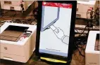  ?? CURTIS COMPTON / CCOMPTON@AJC.COM ?? Some voters are worried about the new voting machines’ 21.5-inch touchscree­ns.