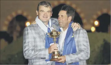  ?? Picture: Getty ?? Lawrie with captain Jose Maria Olazabal after helping Europe win the Ryder Cup in 2012