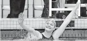  ?? [PHOTO BY JAMES GIBBARD, TULSA WORLD] ?? McGuinness’ Hanna Newby reacts after winning the girls 100-yard breaststro­ke in last season’s state swim meet.