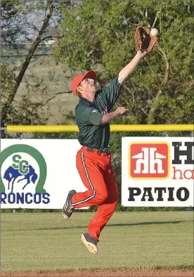  ?? STEVEN MAH/SOUTHWEST BOOSTER ?? 57’s second baseman Will Baker climbed the ladder to snag a line drive against Weyburn last week.