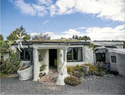 ?? PHOTO: DAVID WALKER/STUFF ?? Terry and Lisa’s Tuahiwi home, affectiona­tely known as the Flintstone house, is as quirky as they come.