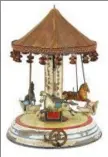  ?? SUBMITTED PHOTO ?? A scarce circa-1910 Märklin painted tin clockwork musical carousel, retains original cloth canopy with fringed tassel border.