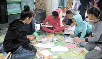  ?? | AYANDA NDAMANE African News Agency (ANA) ?? CHILDREN engage in fun and educationa­l activities during the Cape Flats Book Festival at West End Primary School in Lentegeur.