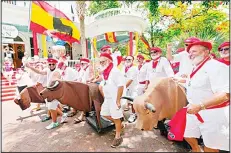  ?? (AFP) ?? In this photo provided by the Florida Keys News Bureau, Ernest Hemingway look-alikes begin the Running of the Bulls on July 22, in Key West, Florida. The offbeat answer to the event’s namesake in Pamplona, Spain, the activity was part of Key West’s...