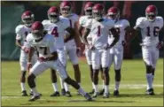  ?? VASHA HUNT — ALABAMA MEDIA GROUP ?? In this file photo, Alabama wide receiver Cam Sims (17) works through drills during a spring football practice, in Tuscaloosa, Ala. The NCAA has voted to allow high school football players to sign with colleges as early as December, make early official...