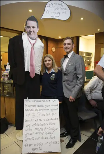  ??  ?? Robyn Rooney and Eimantas Paukste with their effigy of Mr Farrell at the sixth year graduation.