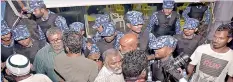  ??  ?? Maldives police forcibly enter the main opposition camp. AFP