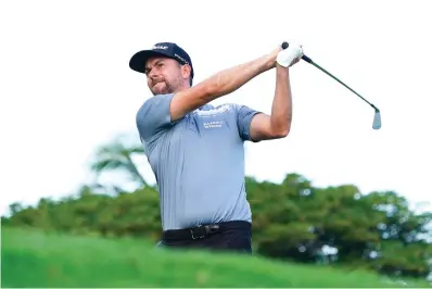  ?? AP Photo/Matt York ?? Webb Simpson plays his shot from the 11th tee Jan. 12 during the Sony Open golf tournament pro-am event at Waialae Country Club in Honolulu.