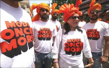  ??  ?? Supporters of the Bharatiya Janata Party (BJP) wear T-shirts supporting Indian Prime Minister Narendra Modi in Bhopal. Some 190 million voters in 15 states are eligible to take part in the polls.