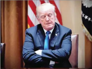  ?? MANDEL NGAN/AFP ?? US President Donald Trump takes part in a meeting with bipartisan members of Congress on school and community safety in the Cabinet Room of the White House on Wednesday.