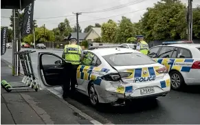  ?? GEORGE HEARD/STUFF ?? Police arrested a man in his 20s after a chase in Christchur­ch that ended when he crashed into three police cars.