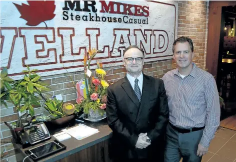  ?? MICHELLE ALLENBERG/ WELLAND TRIBUNE ?? Greg Smith, left, and one of his three partners, Mike Gowan, are excited to have officially opened Mr. Mikes Steakhouse Casual in Welland.