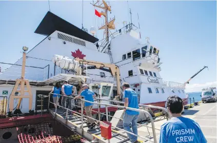  ?? DARREN STONE, TIMES COLONIST ?? Scientists board the Canadian Coast Guard Ship John P. Tully at the Institute of Ocean Sciences on Tuesday.