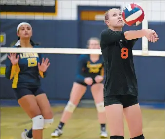  ?? SARAH GORDON/THE DAY ?? Montville’s MacKenzie Clark (8) bumps a ball during Wednesday night’s high school volleyball match against Ledyard. Ledyard won 25-23, 25-7, 25-20.