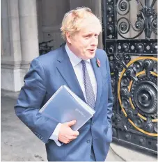  ?? — AFP file photo ?? Johnson leaves 10 Downing Street in London to a end the weekly cabinet meeting held at the nearby Foreign, Commonweal­th and Developmen­t Office on Nov 10.