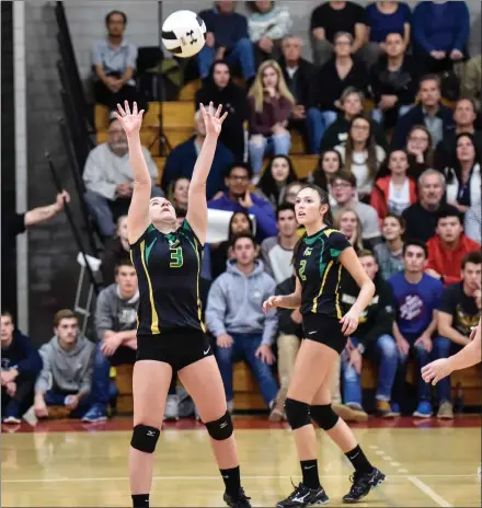  ?? Photos by Jerry Silberman / risportsph­oto.com ?? North Smithfield setter Jacqueline Eddy (3) sets the ball to an outside hitter, while junior middle Morgan Kruzan (8, below) hits a roll shot in the No. 2 Northmen’s four-game defeat to No. 1 East Greenwich in the Division II semifinals at East...