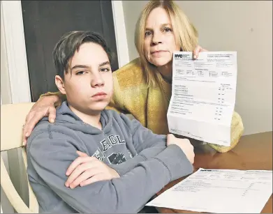  ??  ?? BAD MARKS: John Tomasi was never enrolled at Cobble Hill School, but that didn’t stop it from sending him report cards — and sending a worker from the Administra­tion for Children’s Services to his home to probe mom Margaret.