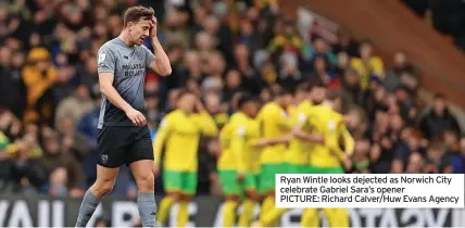  ?? ?? Ryan Wintle looks dejected as Norwich City celebrate Gabriel Sara’s opener
PICTURE: Richard Calver/Huw Evans Agency