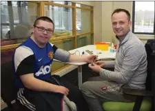  ??  ?? Aidan Sinnott from Raheenvarr­en getting his blood sugar level checked by Anthony Rochford.