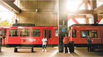  ?? SAM HODGSON U-T FILE ?? San Diego Metropolit­an Transit System trolley cars pull into the 12th and Imperial station in downtown San Diego in August. Supporters of broader mass transit in San Diego are looking to a possible tax hike measure.