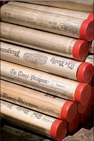  ?? AP/ The Times-Picayune/BRETT DUKE ?? A stack of plastic tubes holds vintage New Orleans newspapers from the collection of Joseph Makkos. Makkos plans to toss the tubes and re-file the papers in a flat file.