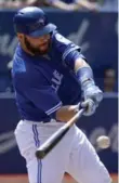  ?? ANDREW LAHODYNSKY­J/TORONTO STAR ?? Russell Martin doubles in the fifth, making the O’s pay for intentiona­lly walking Michael Saunders.