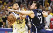  ?? JED JACOBSOHN / AP ?? Warriors guard Stephen Curry shoots against the Mavericks’ Luka Doncic during the second half of Game 2 of the Western Conference finals on Friday. Curry scored 32 points in Golden State’s 126-117 comefrom-behind victory.