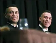  ?? ASSOCIATED PRESS ?? This photo shows National League Most Valuable Player Giancarlo Stanton, left, and American League Rookie of the Year Aaron Judge sitting side-by-side during the New York Chapter of the Baseball Writers’ Associatio­n of America annual dinner in New York...
