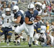  ?? CHRIS KNIGHT — THE ASSOCIATED PRESS ?? Penn State quarterbac­k Trace McSorley (9) runs in for a touchdown against Kent State during the first half of an NCAA college football game in State College, Pa., Saturday.