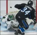  ?? THE CANADIAN PRESS/ADRIAN WYLD ?? Saint John Sea Dogs defenceman Chase Stewart scores on Seattle Thunderbir­ds goalie Carl Stankowski in Windsor, Ont. on Tuesday.