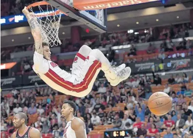  ?? MICHAEL LAUGHLIN/STAFF PHOTOGRAPH­ER ?? Tyler Johnson of the Heat scores in the first half of Wednesday’s game against the Toronto Raptors at BB&T Center.