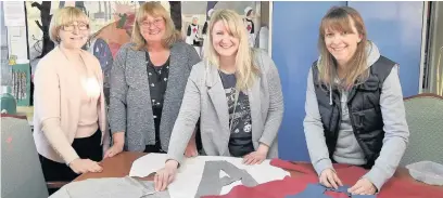  ??  ?? ●● Volunteers Irene Dearnaley, Kathryn Willcox, Susie Williamson and Fiona Williams get to work on the Barnaby washing lines