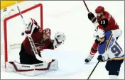  ?? ASSOCIATED PRESS ?? ST. LOUIS BLUES right wing Vladimir Tarasenko (91) sends the puck past Arizona Coyotes goaltender Darcy Kuemper, left, for a goal as Coyotes defenseman Oliver Ekman-Larsson (23) watches during the first period of a game Thursday in Glendale.