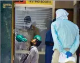  ?? PTI ?? Suspected COVID-19 patients wait to be examined by medics at a government hospital in New Delhi on Tuesday