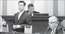  ?? Rich Pedroncell­i
Associated Press ?? THEN-STATE SENS. Leland Yee, left, and Ronald S. Calderon in the Senate chamber in January 2014. The two are awaiting trial on corruption charges.