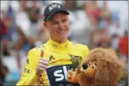  ?? CHRISTOPHE ENA — THE ASSOCIATED PRESS ?? Britain’s Chris Froome flashes a thumbs up on the podium after the 20th stage of the Tour de France.