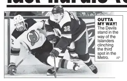  ?? AP ?? OUTTA MY WAY! The Devils stand in the way of the Islanders clinching the third spot in the Metro.