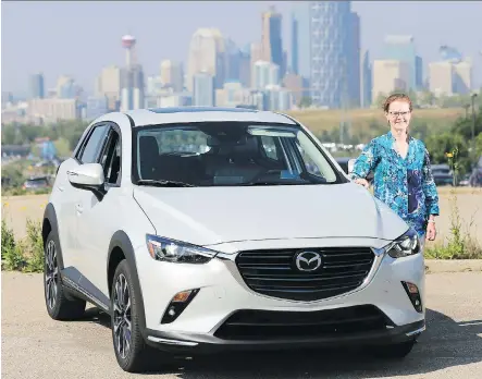  ?? GAVIN YOUNG / POSTMEDIA NEWS ?? Gillian Macartney stands by the 2018 Mazda CX-3 she test drove.